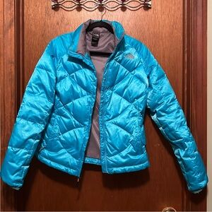 The North Face puffer, like new, beautiful light blue, size medium.